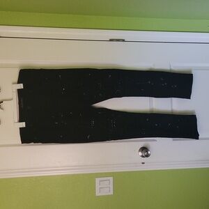 Black jeans with studs and paint splatter
